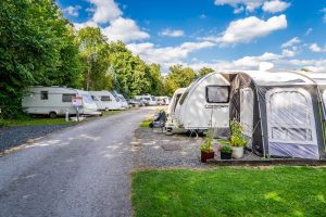 Hardstanding touring caravan pitches with a Challenger caravan and awning pitched up.